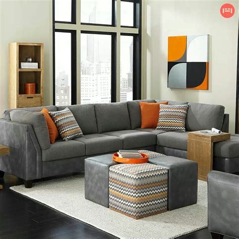 Supported by a solid and manufactured wood frame, this sofa strikes a streamlined silhouette with a pair of back cushions, track arms, and round tapered legs in a pecan finish. Slate and burnt orange💖 it (With images) | Small living room furniture, Living room sectional ...