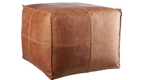 Scatter several of poufs on a floor around a low coffee table or by the fireplace. brown leather pouf | CB2