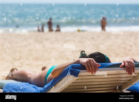 Girl Sunbathes On The Beach Stock Photo Alamy