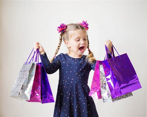 Kids Shopping Smiling Little Girl With Shopping Bags Stock Photo