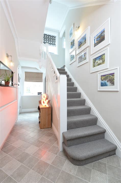 Whenever a staircase is long, or there are multiple staircases that come together, a visually lightweight stair railing is a good design choice so as to not. Stunning Family Home Renovation - Transitional - Staircase - Manchester - by Hannah Barnes Designs