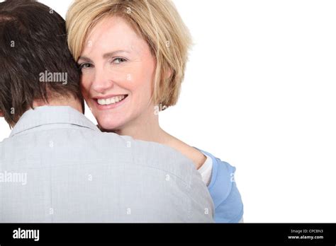Smiling Woman Embracing Her Partner Stock Photo Alamy