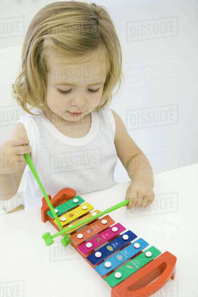 Toddler Girl Playing Xylophone High Angle View Stock Photo Dissolve