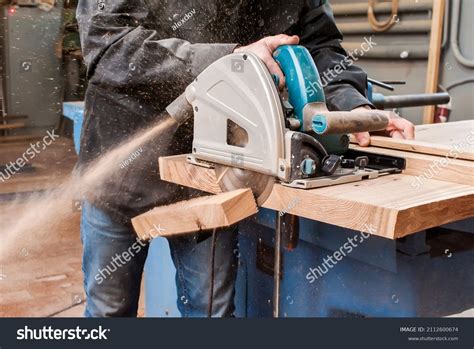 Male Carpenter Sawing Board Circular Saw Stock Photo 2112600674