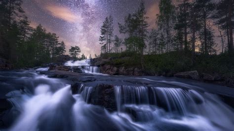 Starry Night Sky Over Cascading Waterfalls Image Abyss