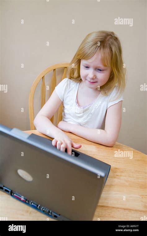 Young Girl Using A Laptop Computer Stock Photo Alamy