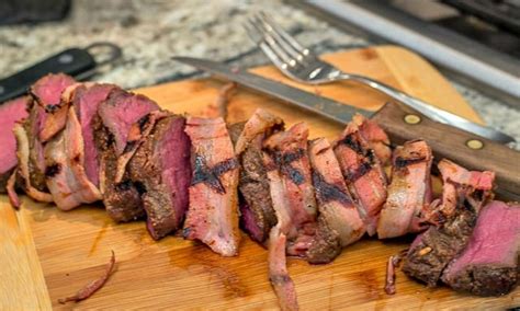 Sear the tenderloin for just a few minutes on each side, about 8 minutes total cook time. Grilled Bacon-Wrapped Venison Backstrap with Balsamic Cherries and Farro - That Susan Williams