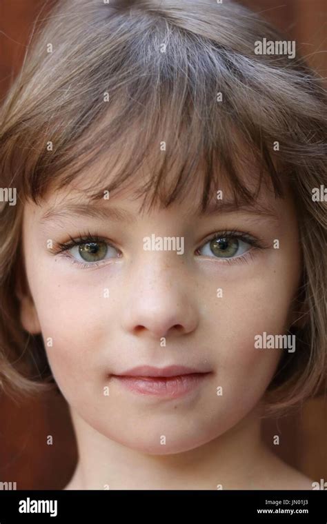 Close Up Portrait Of A Young Brunette Green Eyed Girl Stock Photo Alamy