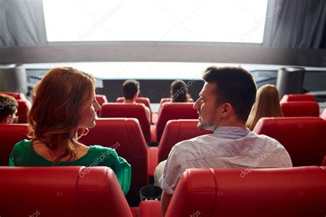 Happy Couple Watching Movie In Theater Or Cinema Stock Photo By ©syda