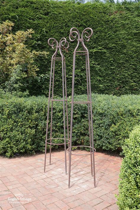 Maybe you would like to learn more about one of these? Weathered wrought iron garden obelisk