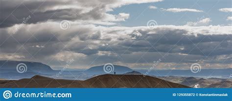 Silhouette Of Two Women Talking And Hiking On A Volcano