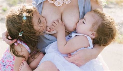 This Mother Did A Photoshoot Breastfeeding Her 2 Daughters