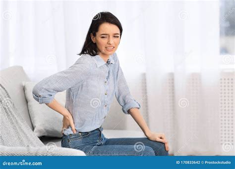 Young Woman Suffering From Pain In Lower Back Stock Photo Image Of