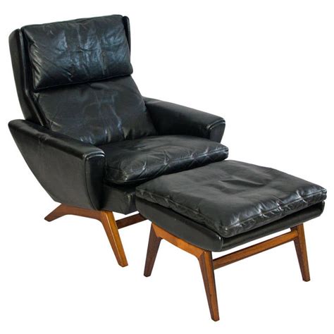 A mid century modern upholstered club chair and matching ottoman resting on a wood and chrome base circa 1970. Mid Century Danish Leather Lounge Chair and Ottoman ...