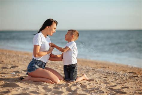 Mother And Son On The Beach Stock Photo Image Of Foam Holiday 125838668