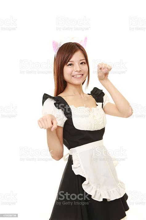 Japanese Woman Wearing French Maid Costume In Cat Pose Stock Photo