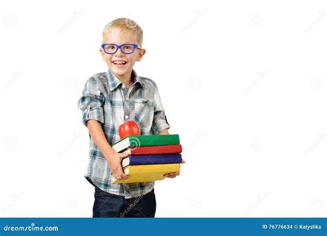 Portrait Of Funny Schoolboy With Books And Apple Isolated On White