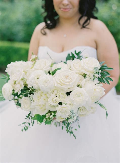 lush bridal bouquet featuring italian ruscus garden roses and white lisianthus