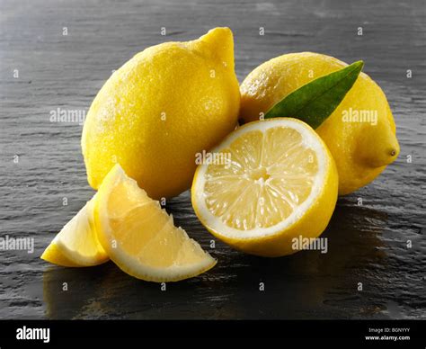 Fresh Whole And Cut Lemons Stock Photo Alamy