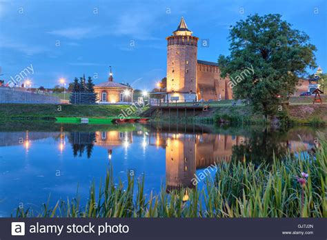 Tower An Wall Of Kolomna Kremlin Reflecting In Water In The Evening