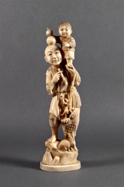 Lot A Japanese Carved Ivory Okimono Of A Father And Child Meiji