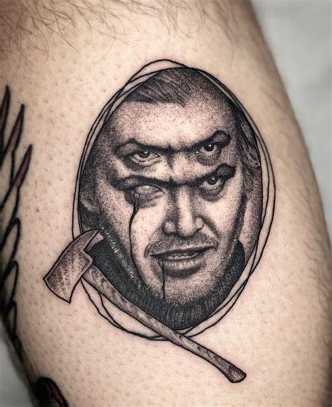 A Mans Thigh With A Portrait Of Him In The Center And An Arrow On It