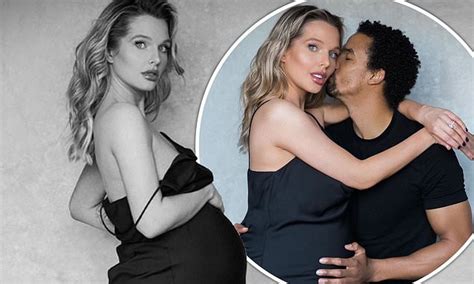 Heavily Pregnant Helen Flanagan Cradles Her Blossoming Bump In A Black