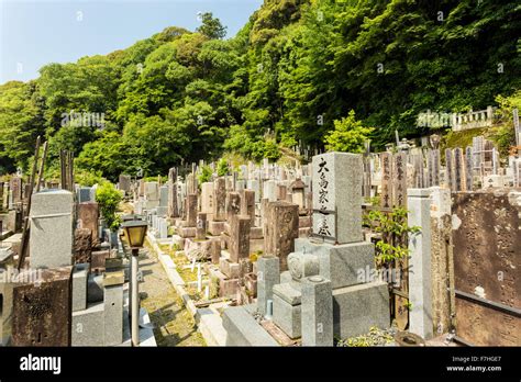 old-graves-and-headstones-of-the-deceased-at-a-buddhist-cemetery-stock