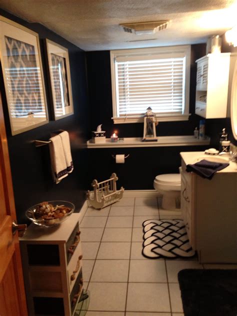 Toy sharks, circular mirrors, anchors, sailboats, blue paint, ropes, circular windows and many more. Nautical bathroom | Modern bathroom decor, Bathroom ...