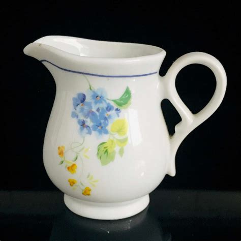 Find this pin and more on home renovation by fondazione when it comes to decorating a home, most people want to achieve an elegant home decor that is timeless. Vintage cream pitcher floral blue yellow green detailed ...