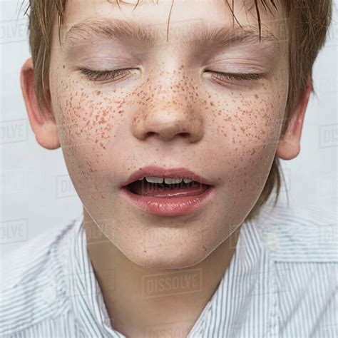 Close Up Of Caucasian Boy With Freckles Stock Photo Dissolve