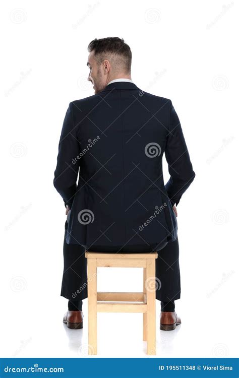 Back View Of A Businessman Looking Over His Shoulder Stock Photo