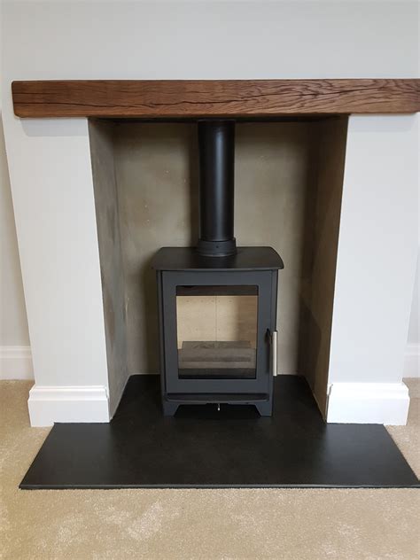 Heta Inspire 40 on a Black Riven Slate Hearth with Oak Beam | Slate