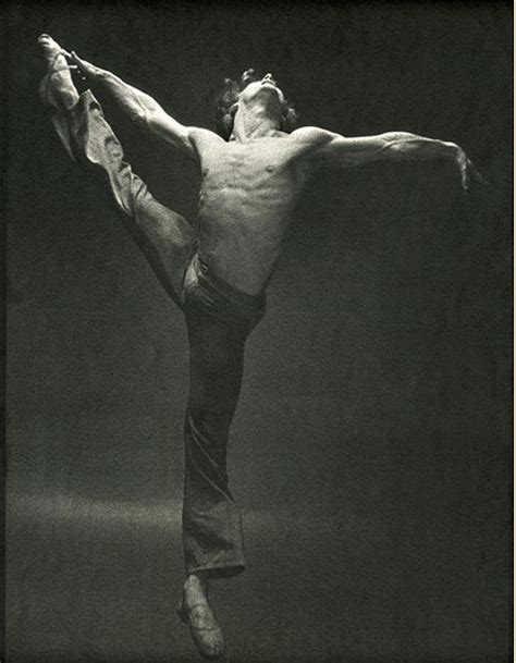 A Black And White Photo Of A Man Doing An Acrobatic Dance Pose