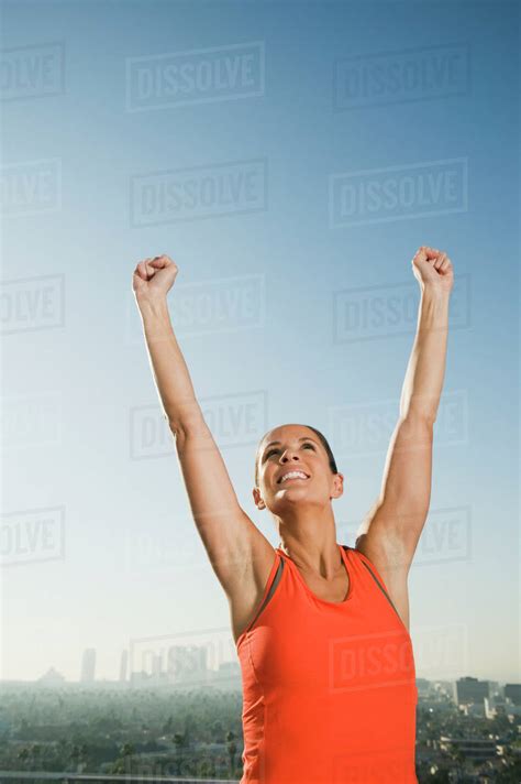 Woman Raising Her Arms Stock Photo Dissolve