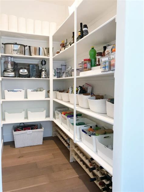 Walk in kitchen pantry cabinet. A Crisp White Walk-In Pantry | Walk in pantry, Built in ...