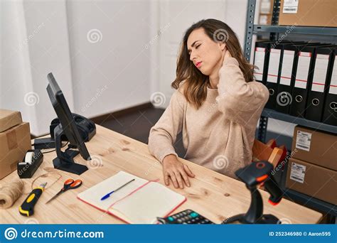 Young Woman Ecommerce Business Worker Suffering For Neck Pain At Office