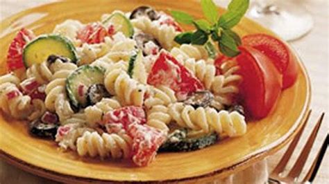 To make dressing, add juice and vinegar to reserved oil. Christmas Pasta Salad recipe - from Tablespoon!