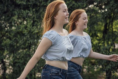 Redheaded Twins Running Stock Photo