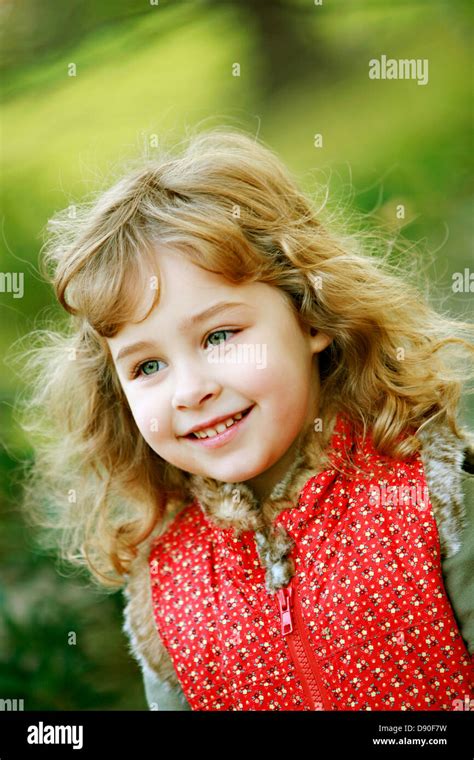 A Smiling Girl Outside Stock Photo Alamy
