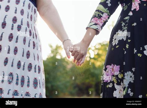 Two Best Friends Holding Hands Partial View Stock Photo Alamy