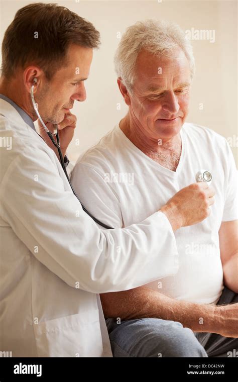 Doctor Checking Senior Mans Heart With Stethoscope Stock Photo Alamy