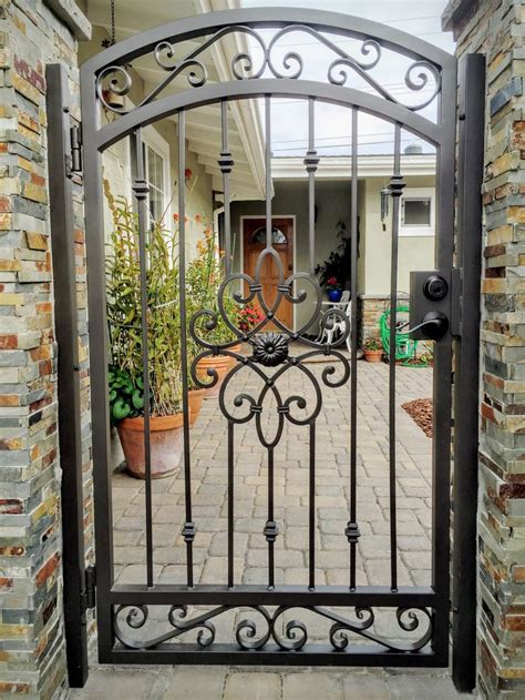Metal gates provide a great combination of style and security, yet have that sleek, modern look. Check out this beautiful center piece design. We do all kinds of iron designs for your hom ...