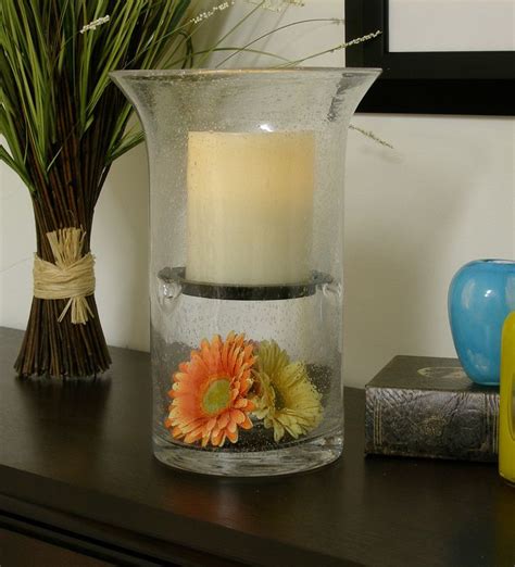 Hurricane candle holders get their name from their ability to shield a candle flame from all but the stiffest passing breeze. Hand Blown Glass Hurricane Fillable Candle Holder Vase ...