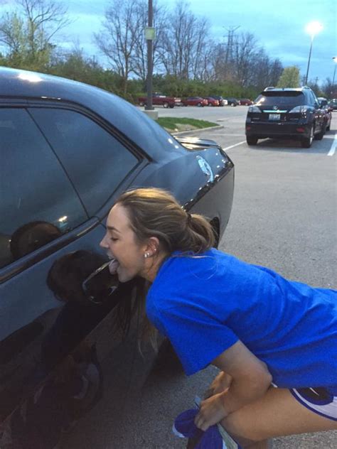 a bunch of kentucky basketball fans are licking devin booker s car and no one really knows why