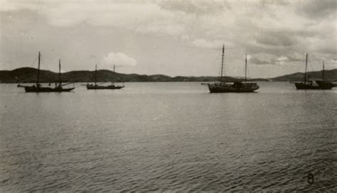 Masted Fishing Boats Anchored In The Bay At Port Moresby Papua New