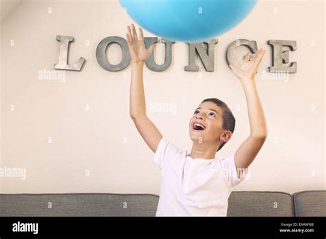Boy Catching Large Ball Stock Photo Alamy