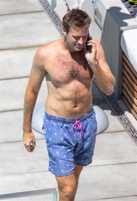 Armie Hammer Goes Shirtless Reveals New Tattoo On Rare Outing Before