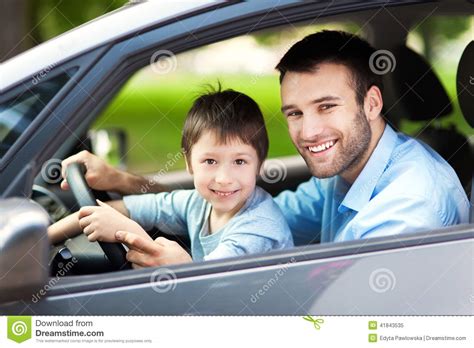 Father And Son Sitting In A Car Stock Photo Image 41843535