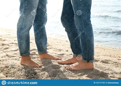 Gay Couple Standing Barefoot On Beach Stock Image Image